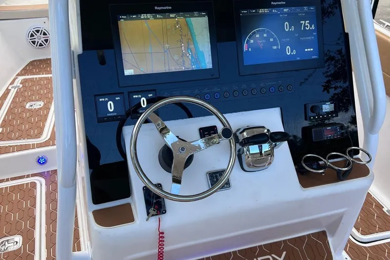  Yacht Photos Pics Century 3200 Center Console 2019 dashboard with navigation screens and steering wheel.