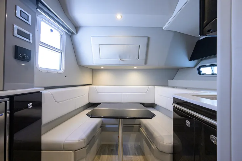 Das Liebesboot Yacht Photos Pics 2021 Formula 380 Super Sport Crossover OB interior with modern seating and dining area.