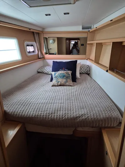 Chapter Two Yacht Photos Pics Cozy bedroom in 2014 Lagoon 450 yacht with modern decor and ample natural light.