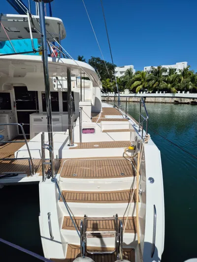 Chapter Two Yacht Photos Pics 2014 Lagoon 450 catamaran docked, featuring spacious deck and modern design.