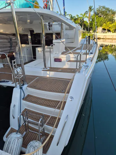 Chapter Two Yacht Photos Pics 2014 Lagoon 450 catamaran docked, featuring spacious deck and elegant design.