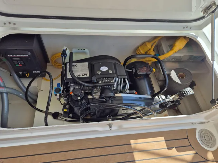 Chapter Two Yacht Photos Pics Engine compartment of a 2014 Lagoon 450 yacht, featuring mechanical components and wiring.