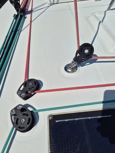 Chapter Two Yacht Photos Pics Close-up of 2014 Lagoon 450 sailboat deck with ropes and pulleys.