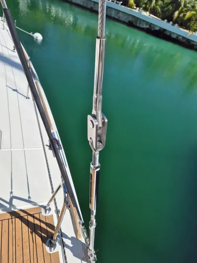 Chapter Two Yacht Photos Pics Lagoon 450 sailboat deck with stainless steel rigging, 2014 model, near calm green water.