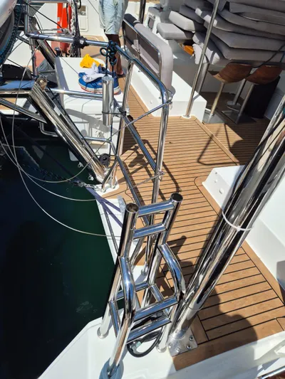 Chapter Two Yacht Photos Pics Lagoon 450 yacht deck with stainless steel ladder and wooden flooring, 2014 model.