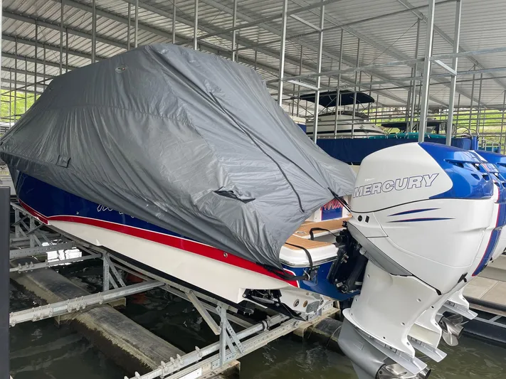  Yacht Photos Pics 2015 Nor-Tech 340 Sport Center Console boat covered, docked with Mercury outboard engine.