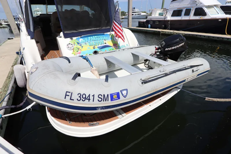  Yacht Photos Pics 2004 Sea Ray 420 Sundancer with inflatable boat and Mercury motor at marina.