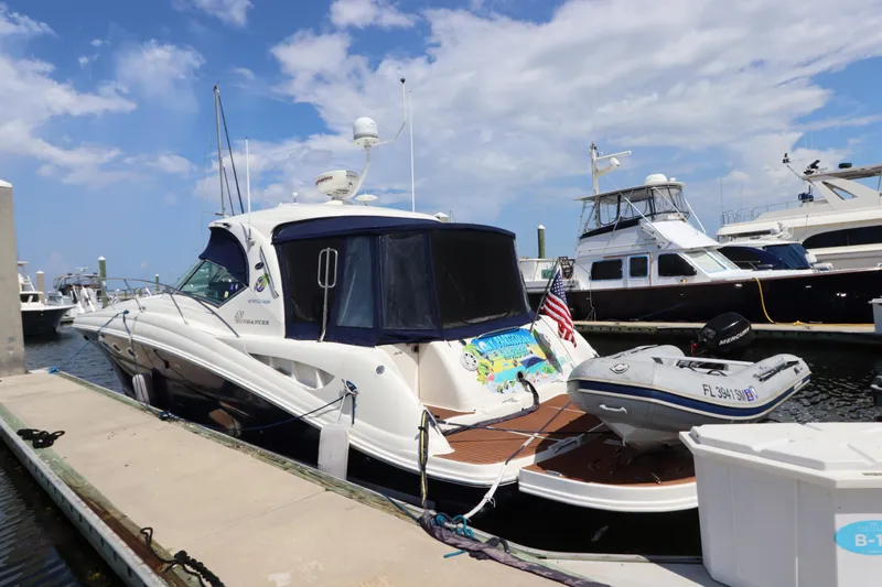  Yacht Photos Pics 2004 Sea Ray 420 Sundancer yacht docked at marina under blue sky.