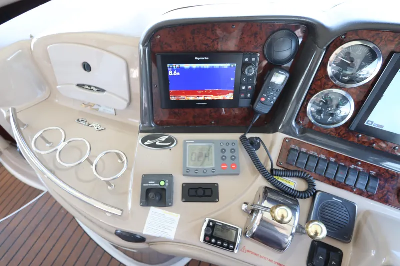  Yacht Photos Pics Control panel of a 2004 Sea Ray 420 Sundancer boat with navigation equipment.