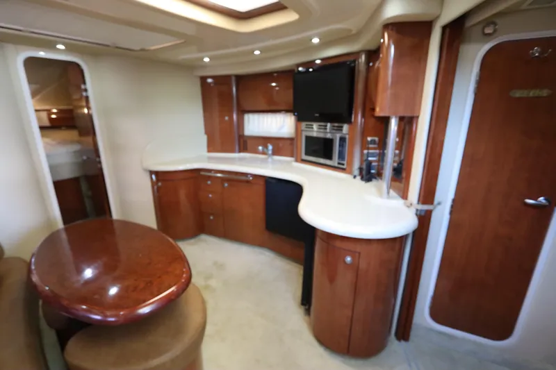  Yacht Photos Pics Luxurious interior of 2004 Sea Ray 420 Sundancer yacht with modern amenities.