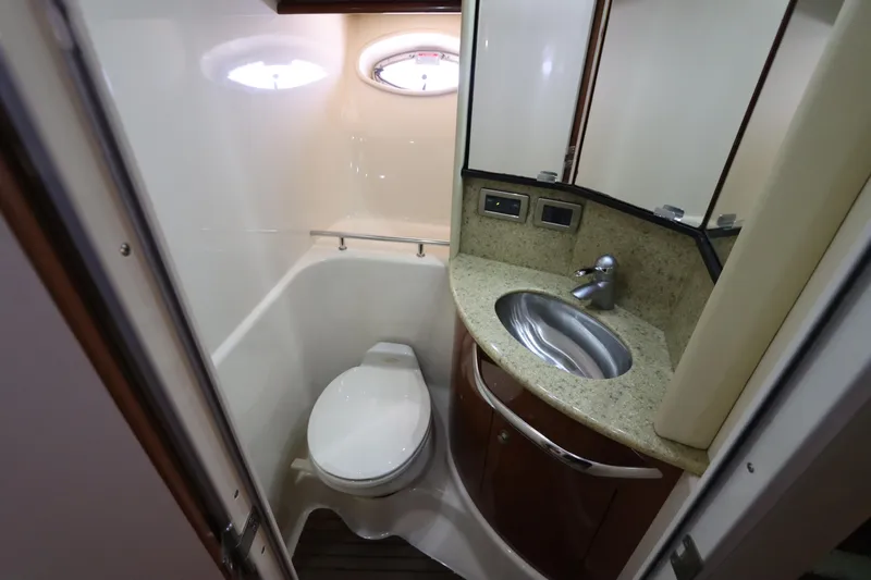  Yacht Photos Pics Bathroom interior of 2004 Sea Ray 420 Sundancer yacht, featuring sink and toilet.