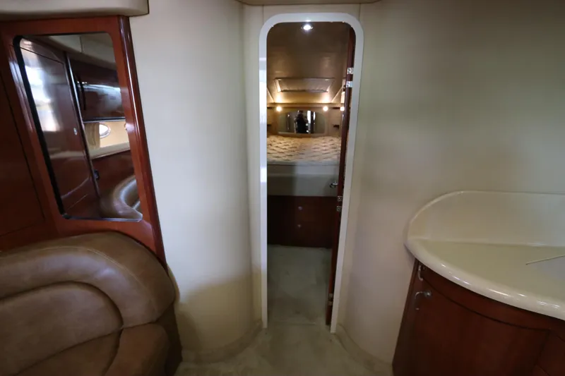  Yacht Photos Pics Interior of 2004 Sea Ray 420 Sundancer yacht, featuring cozy cabin and elegant wood finishes.