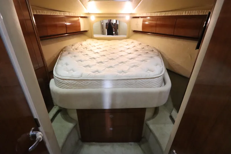  Yacht Photos Pics Luxurious cabin interior of 2004 Sea Ray 420 Sundancer yacht with plush bed.