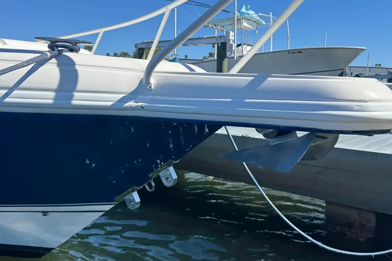  Yacht Photos Pics 2012 Intrepid 390 Sport Yacht anchored at dock, showcasing sleek design and anchor detail.