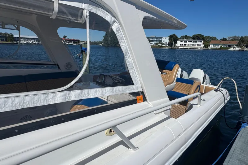  Yacht Photos Pics 2012 Intrepid 390 Sport Yacht docked on a sunny day, showcasing sleek design.