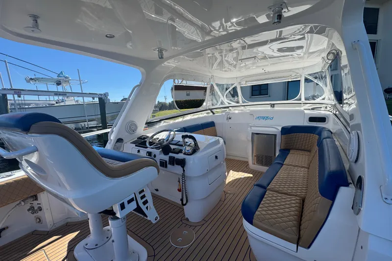  Yacht Photos Pics 2012 Intrepid 390 Sport Yacht interior with helm, seating, and modern design.