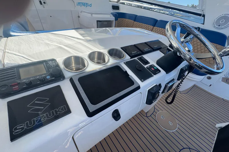  Yacht Photos Pics Cockpit of 2012 Intrepid 390 Sport Yacht with steering wheel and controls.