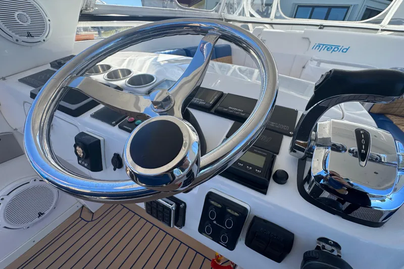  Yacht Photos Pics Steering wheel and controls of a 2012 Intrepid 390 Sport Yacht cockpit.