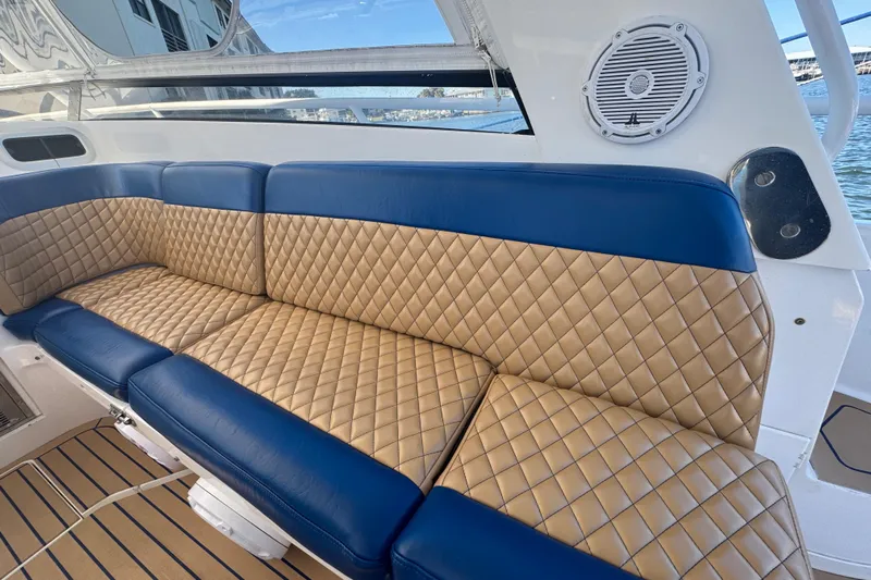  Yacht Photos Pics Luxurious seating on 2012 Intrepid 390 Sport Yacht with quilted upholstery and marine speaker.