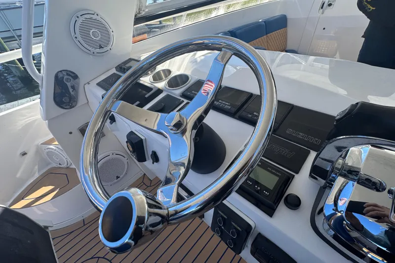 Yacht Photos Pics Steering wheel and controls of a 2012 Intrepid 390 Sport Yacht.