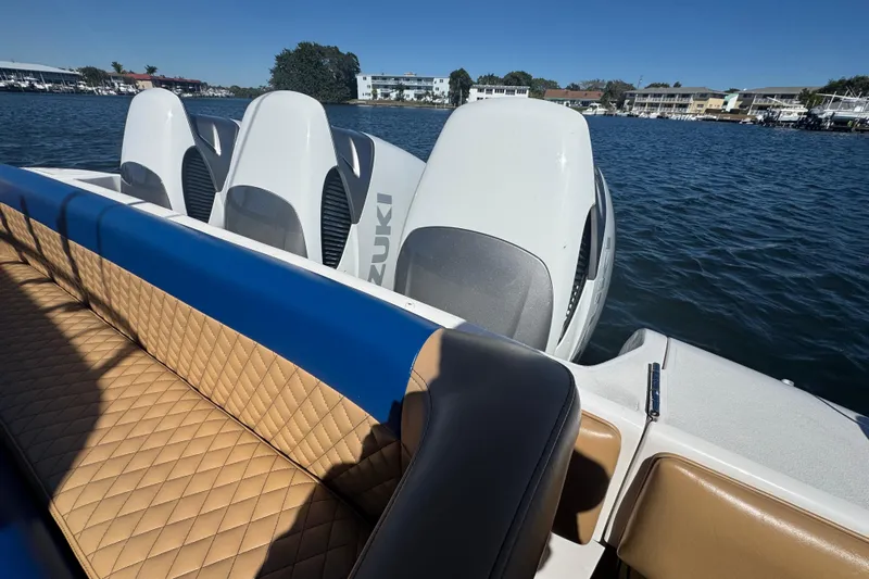  Yacht Photos Pics 2012 Intrepid 390 Sport Yacht with Suzuki engines, featuring tan quilted seating on a sunny day.