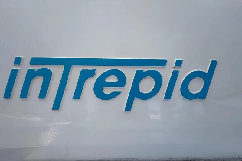  Yacht Photos Pics Intrepid 390 Sport Yacht 2012 logo in blue on white background.