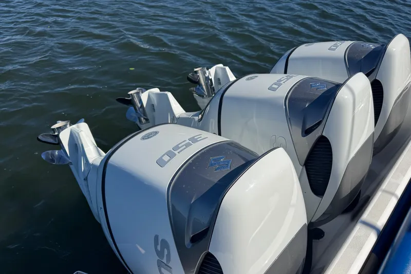  Yacht Photos Pics Triple outboard engines on a 2012 Intrepid 390 Sport Yacht in water.