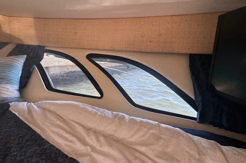  Yacht Photos Pics Interior cabin view of a 2012 Intrepid 390 Sport Yacht with water visible through windows.