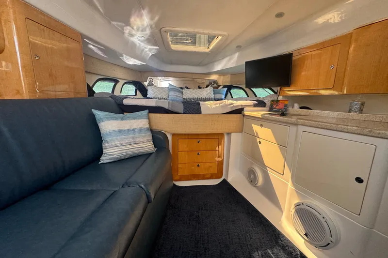  Yacht Photos Pics Luxurious interior of a 2012 Intrepid 390 Sport Yacht with cozy seating and modern amenities.