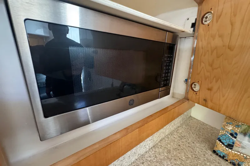  Yacht Photos Pics Built-in GE microwave in 2012 Intrepid 390 Sport Yacht kitchen area.