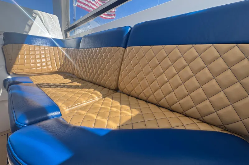  Yacht Photos Pics Luxurious blue and tan seating on a 2012 Intrepid 390 Sport Yacht.