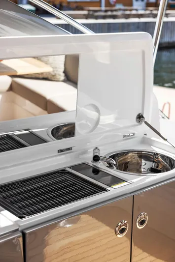 V40188 Yacht Photos Pics Outdoor kitchen on 2024 Princess V40 yacht with grill and sink.