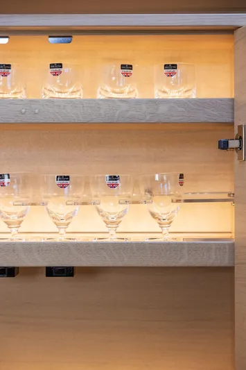 V40188 Yacht Photos Pics Glassware set in a wooden cabinet on a 2024 Princess V40 yacht.