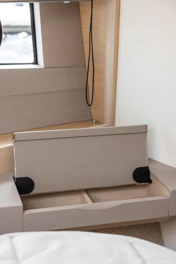 V40188 Yacht Photos Pics 2024 Princess V40 yacht interior detail with modern beige furnishings and window view.