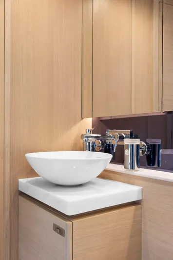 V40188 Yacht Photos Pics Modern bathroom sink in 2024 Princess V40 yacht, featuring sleek design and wooden cabinetry.