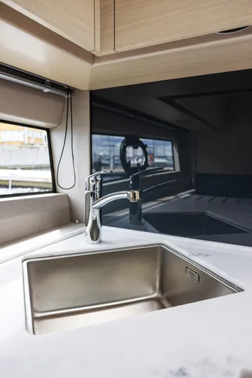 V40188 Yacht Photos Pics Modern kitchen sink in 2024 Princess V40 yacht interior, featuring sleek design and stainless steel finish.