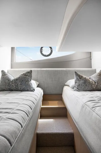 V40188 Yacht Photos Pics Luxurious 2024 Princess V40 yacht cabin with twin beds and elegant decor.