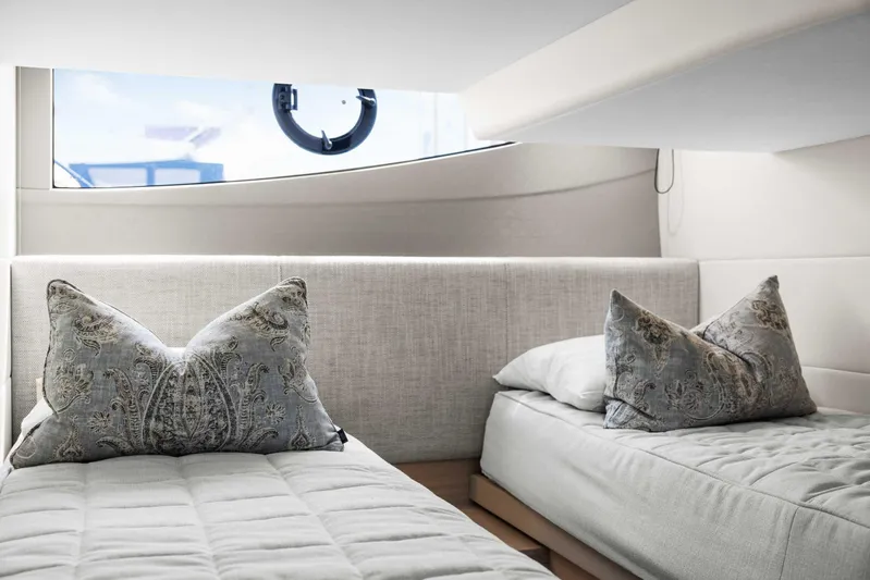 V40188 Yacht Photos Pics Luxurious 2024 Princess V40 yacht cabin with elegant twin beds and decorative pillows.