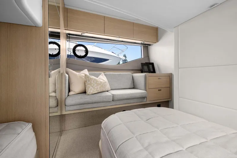 V40188 Yacht Photos Pics Luxurious interior of 2024 Princess V40 yacht with modern furnishings and large window view.