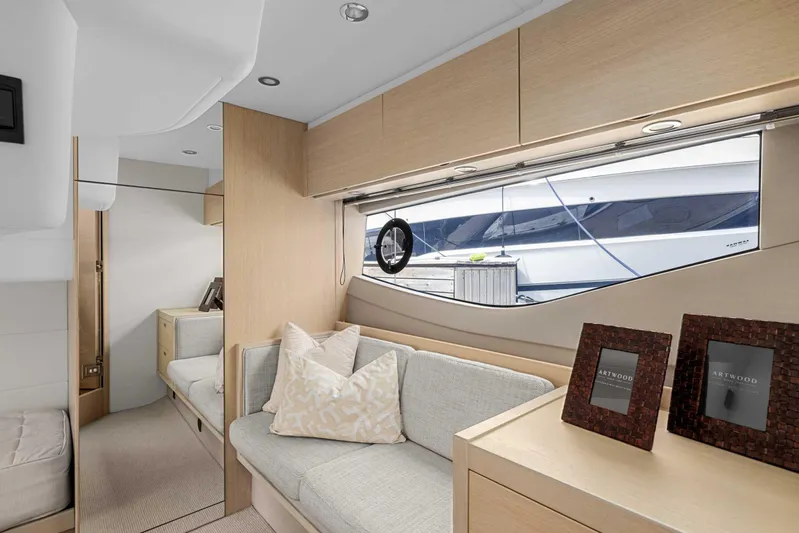 V40188 Yacht Photos Pics Luxurious interior of 2024 Princess V40 yacht with modern furnishings and large window view.