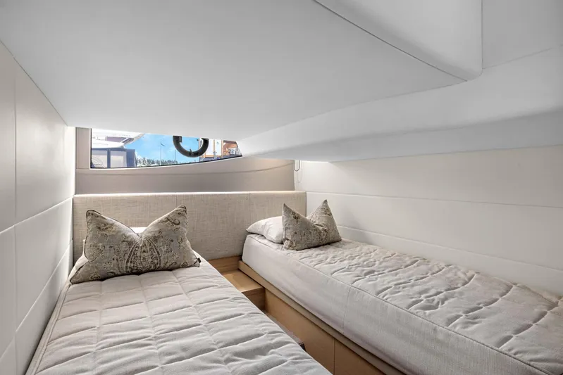 V40188 Yacht Photos Pics Luxurious twin cabin interior of 2024 Princess V40 yacht with elegant bedding.