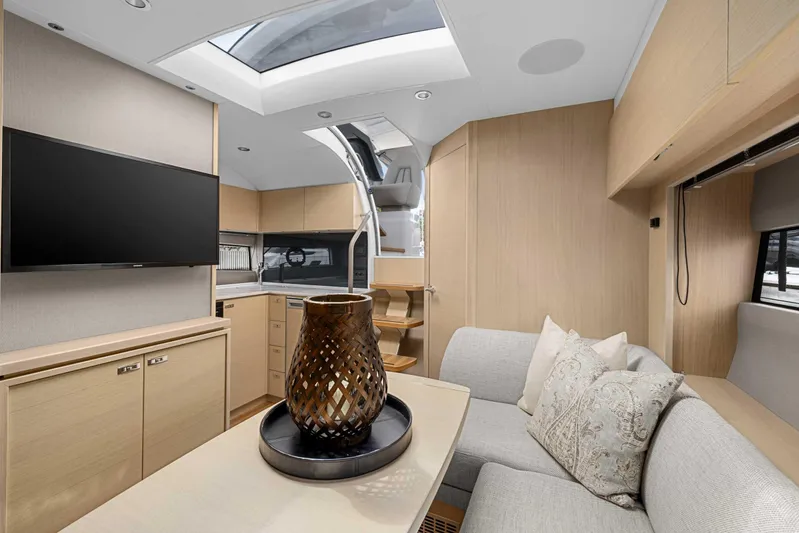 V40188 Yacht Photos Pics Luxurious interior of 2024 Princess V40 yacht with modern decor and skylight.