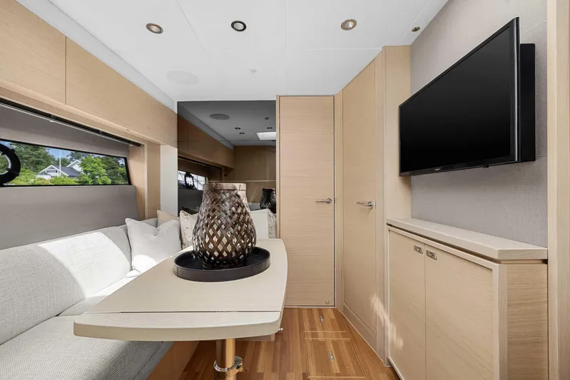 V40188 Yacht Photos Pics Luxurious interior of 2024 Princess V40 yacht with modern decor and flat-screen TV.