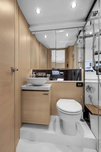 V40188 Yacht Photos Pics Luxurious bathroom in 2024 Princess V40 yacht with modern fixtures and wooden cabinetry.