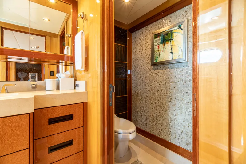 Impromptu Yacht Photos Pics Luxurious bathroom on 2011 Trinity Yachts CUSTOM with modern fixtures and elegant wood finishes.