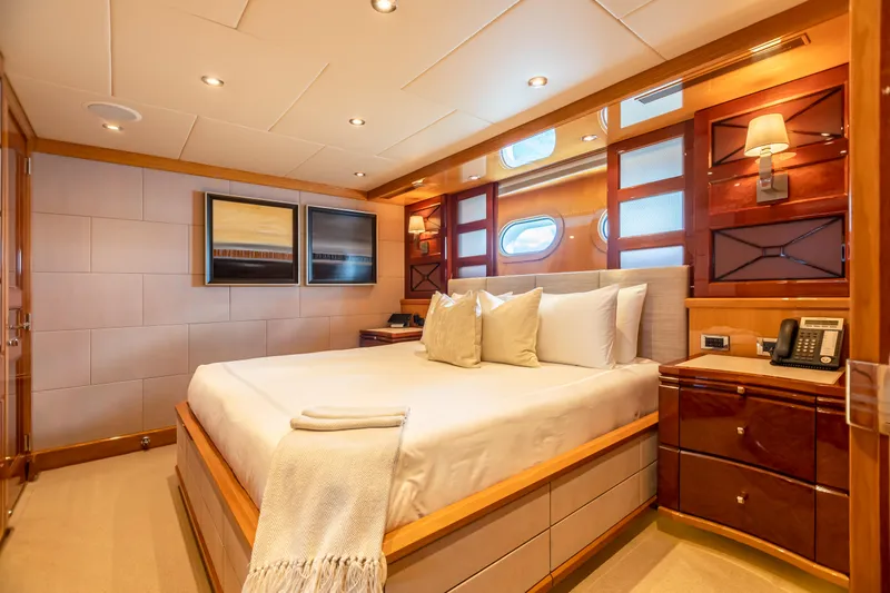 Impromptu Yacht Photos Pics Luxurious bedroom on 2011 Trinity Yachts CUSTOM yacht with modern decor and cozy lighting.