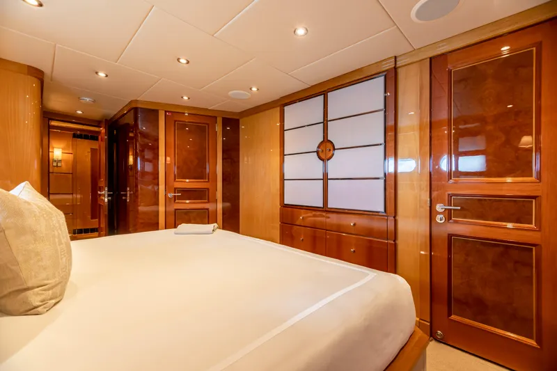 Impromptu Yacht Photos Pics Luxurious bedroom interior of 2011 Trinity Yachts CUSTOM model with wooden finishes.