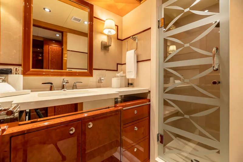 Impromptu Yacht Photos Pics Luxurious bathroom on a 2011 Trinity Yachts CUSTOM yacht with elegant wood cabinetry.