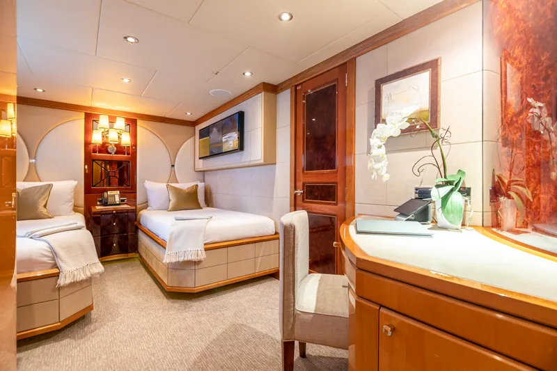 Impromptu Yacht Photos Pics Luxurious bedroom on 2011 Trinity Yachts CUSTOM with twin beds, elegant decor, and ambient lighting.