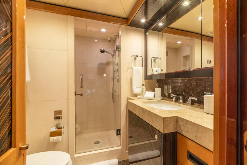 Impromptu Yacht Photos Pics Luxurious bathroom on a 2011 Trinity Yachts CUSTOM yacht with modern fixtures and glass shower.